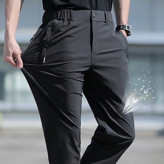 กางเกงฤดูร้อนผู้ชายขนาดใหญ่ผ้าไหมน้ำแข็งขนาดใหญ่ยืดระบายอากาศกางเกงขาตรง 6XL แถบยางยืดแห้งเร็วกางเกงขายาวสีดำ